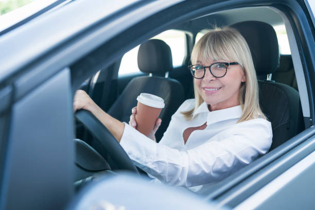 istock Mature businesswoman at car 800344816