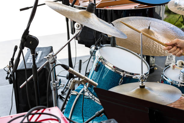 istock street musician playing drums with drumsticks in his hands 800345902