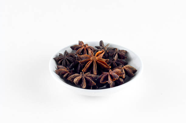 istock Anise spice in bowl over white background 800348972