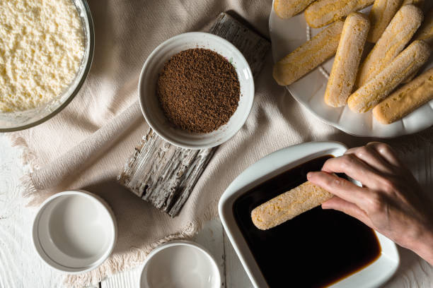 Cooking tiramisu on the white wooden table  top view