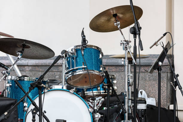 istock blue drum set and plates standing on outdoor stage against wall background 800352484