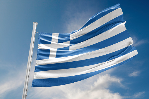 Greece flag is waving at a beautiful and peaceful sky in day time while sun is shining. 3D Rendering
