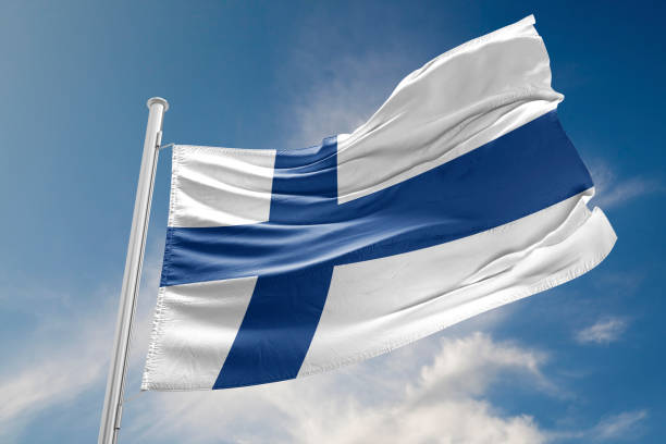 istock Finland Flag is Waving Against Blue Sky 800358700