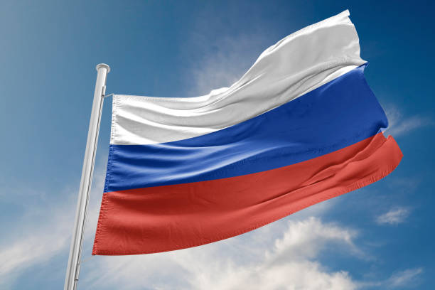 istock Russia Flag is Waving Against Blue Sky 800361520