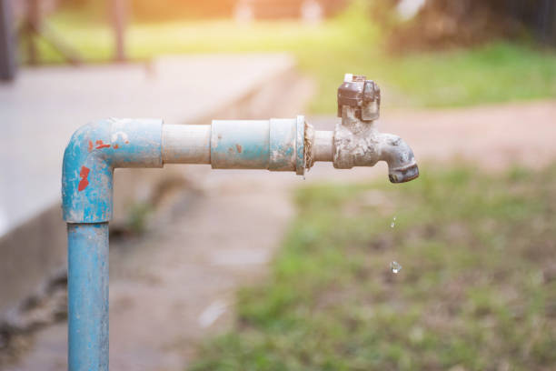 istock water drop in tap,Leaking water 800365142