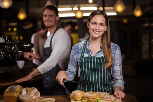 istock Pretty barista smiling at camera 800368772