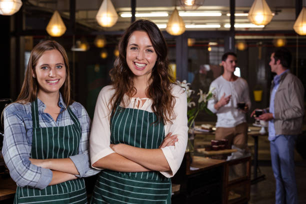 istock Pretty baristas standing with arms crossed 800369162