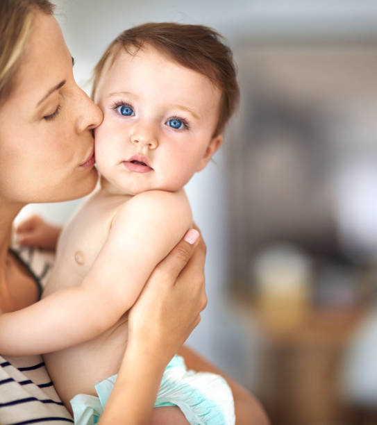 Cuteness overload! Shot of a mother bonding with her adorable baby girl half dressed girls pictures stock pictures, royalty-free photos & images