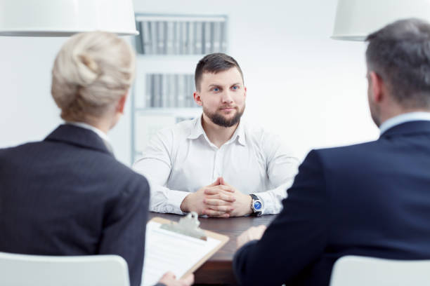 istock Man listening to examination board 800372136