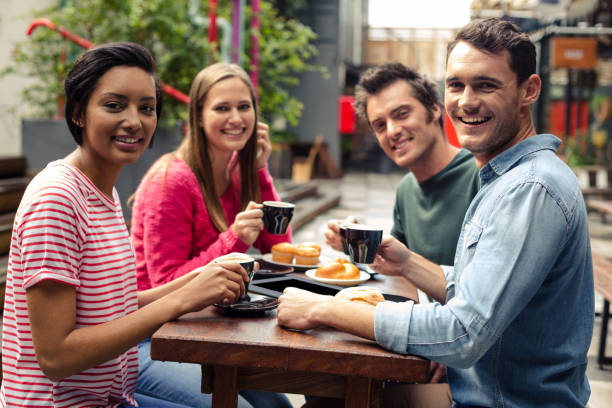 istock Happy friends having coffee together 800386250