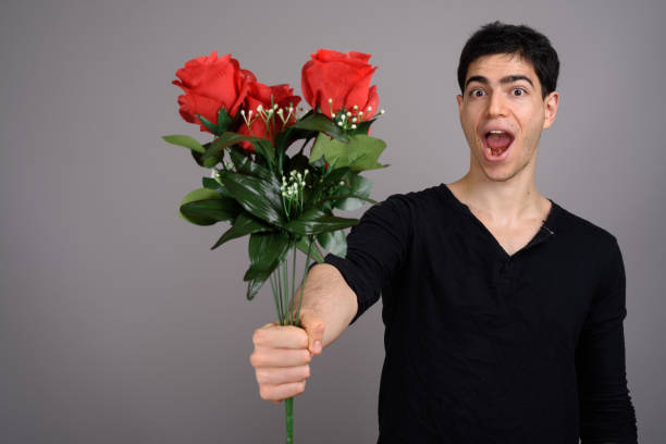 istock Studio shot of young handsome man against gray background 800387318