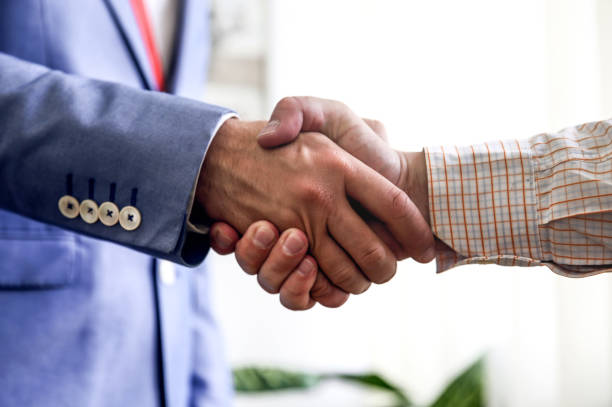 istock Handshaking. Growing business through strengthened partnerships 800390844