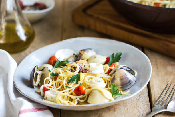 istock Spaghetti with squid, clam and prawn by sea salt 800393994