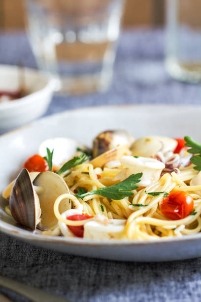 istock Spaghetti with squid, clam and prawn by sea salt 800394002