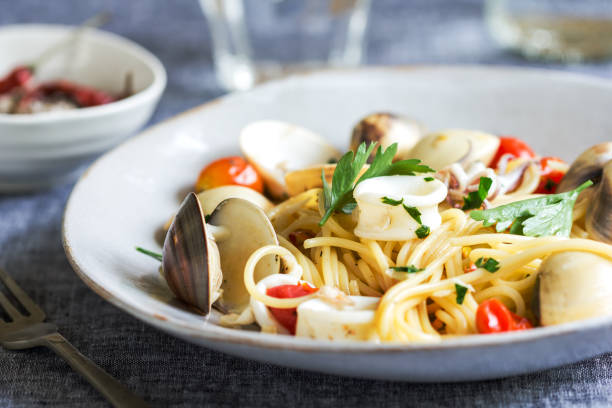 istock Spaghetti with squid, clam and prawn by sea salt 800394220