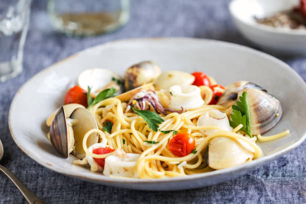 istock Spaghetti with squid, clam and prawn by sea salt 800394654