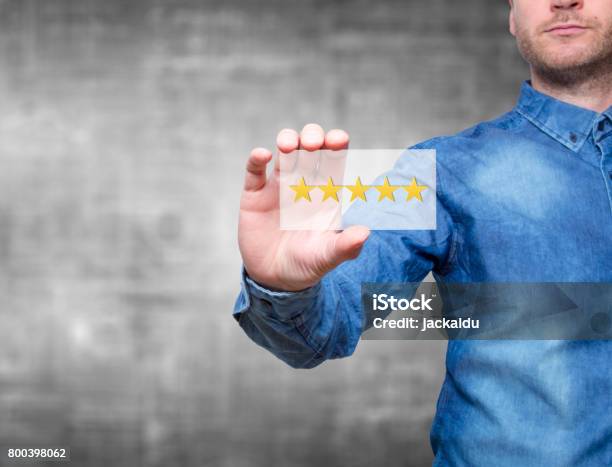 Man Holding Five Star Rating Five Stars Service Grey Background Stock Image Stock Photo - Download Image Now