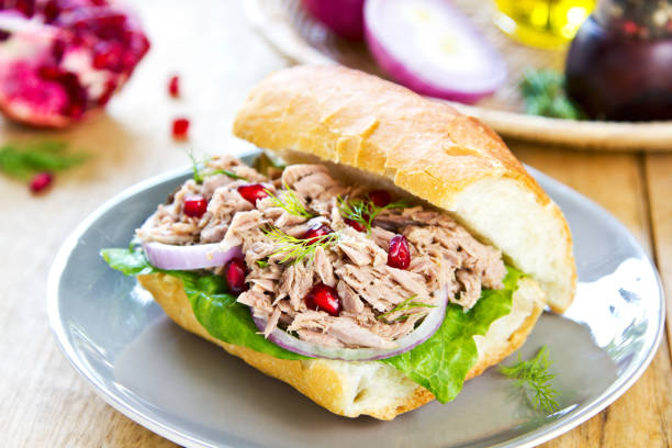 istock Tuna with Dill and Pomegranate on Baguette sandwich 800399280