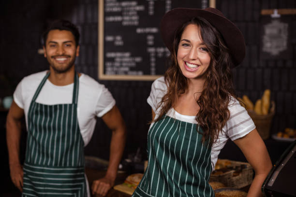 istock Smiling baristas looking at the camera 800402420