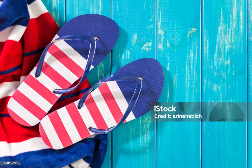 Flip flops with red white and blue pattern with July 4th theme. Beach Stock Photo