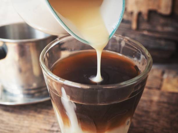 istock Pouring milk coffee vietnam 800405406