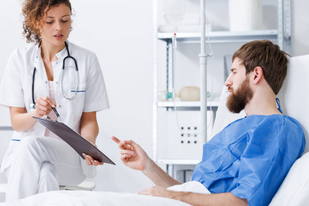 istock Recovery nurse talking with patient 800406214