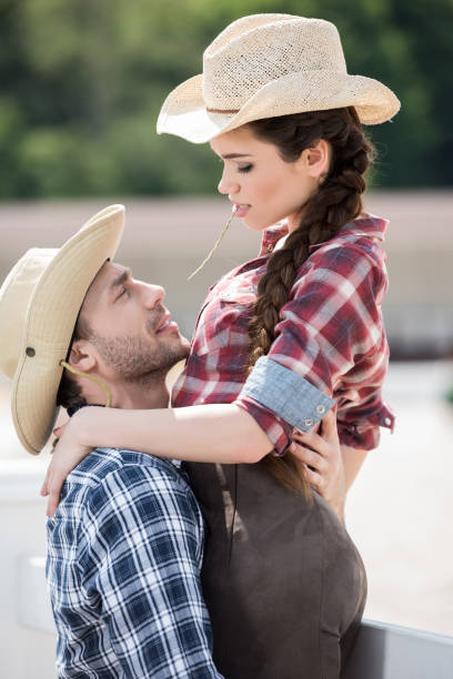 istock young sensual cowboy style couple hugging with straw 800406796