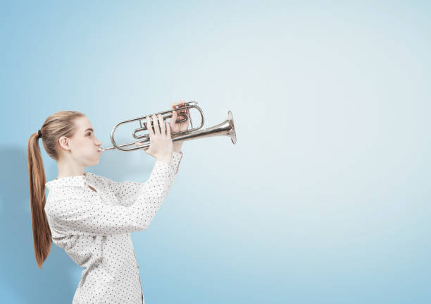 istock Blond woman with trumpet 800414108