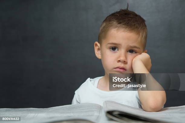 Little Boy Like Businessman In Office With Newspaper And Cellphone Stock Photo - Download Image Now