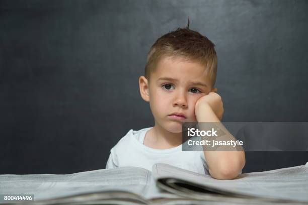 Little Boy Like Businessman In Office With Newspaper And Cellphone Stock Photo - Download Image Now