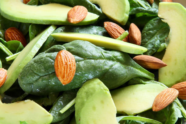 istock spinach avocado almond salad extreme closeup 800416996