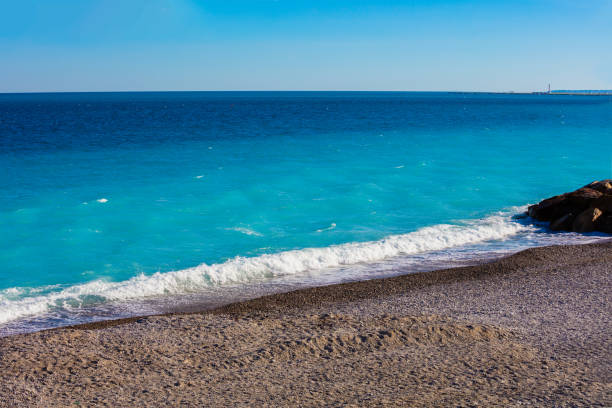 istock Sea wave foam on the beach, sea surf, waves, sea shore. 800416998