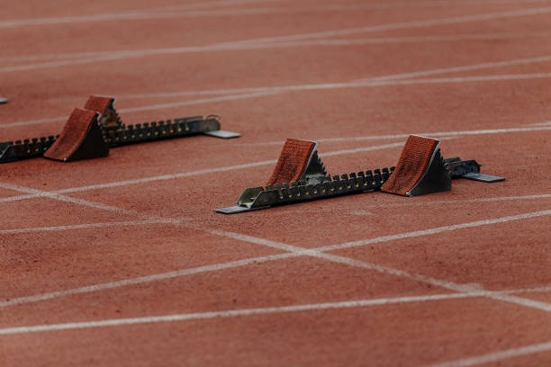 istock starting blocks on start line of sprint 100 meters 800417074