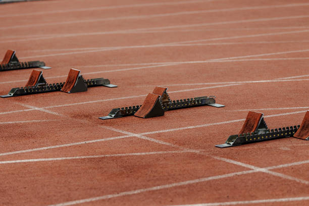 istock starting blocks on start line of running track stadium 800417078