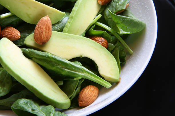 istock spinach salad with almonds and avocado slices 800417180