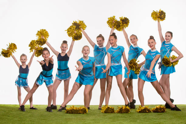 istock The group of teen cheerleaders posing at white studio 800426844