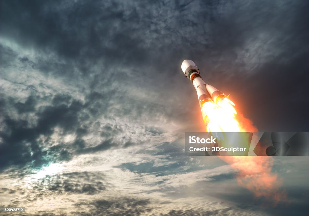 Cargo Carrier Rocket Takes Off To The Clouds Cargo Carrier Rocket Takes Off To The Clouds. 3D Illustration. Missile Stock Photo