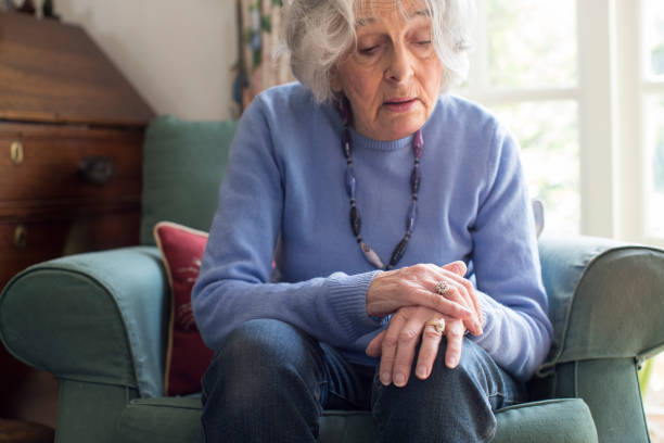 Senior Woman Suffering With Parkinsons Diesease Senior Woman Suffering With Parkinsons Diesease parkinsons disease photos stock pictures, royalty-free photos & images