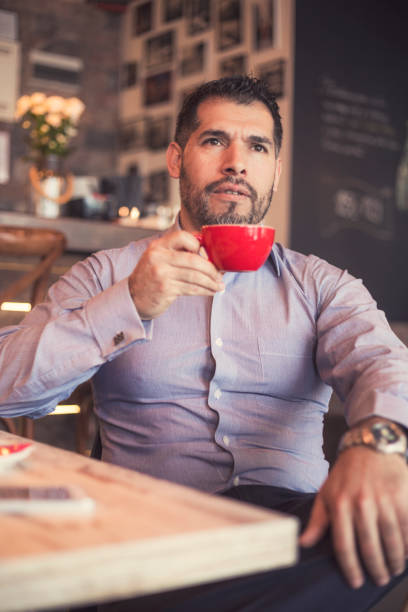 istock Hispanic businessman in cafe bar 800437896