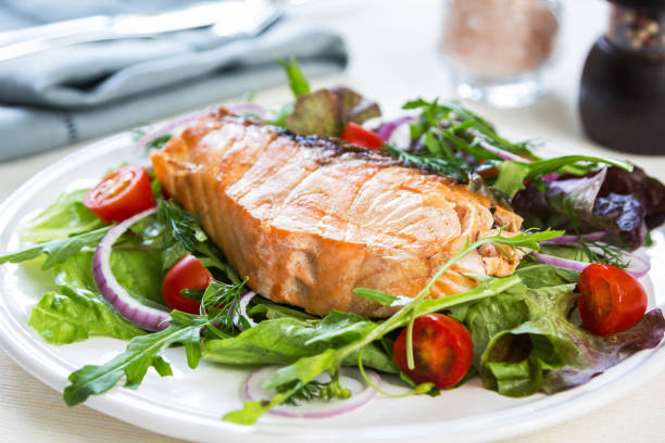 istock Grilled Salmon fillet with fresh salad 800441350