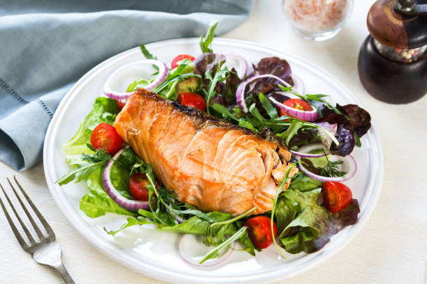 istock Grilled Salmon fillet with fresh salad 800441358