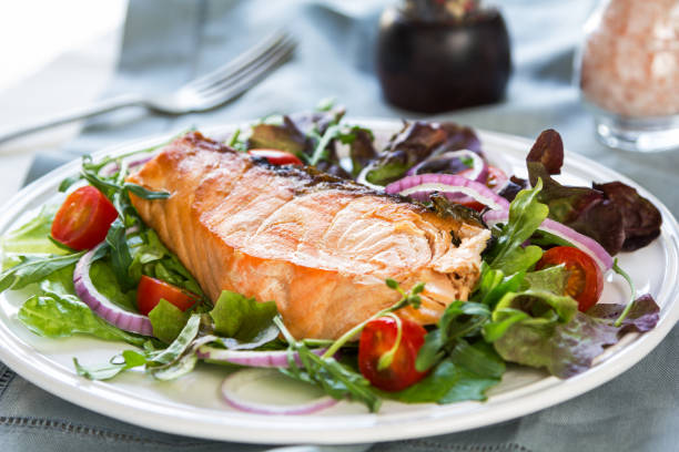 istock Grilled Salmon fillet with fresh salad 800441626