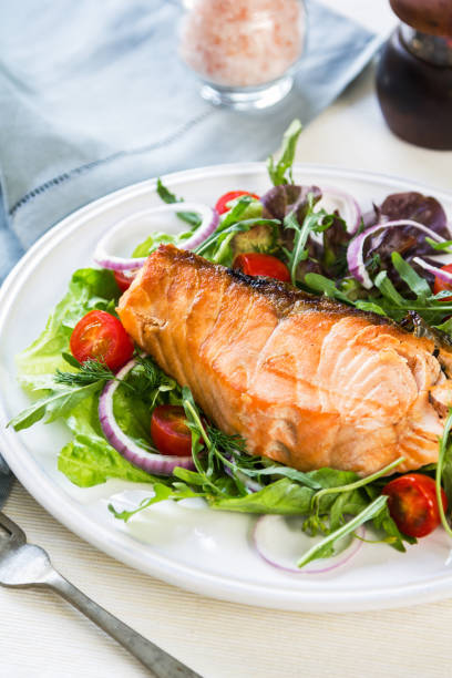 istock Grilled Salmon fillet with fresh salad 800441638