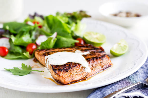 istock Glazed Salmon with salad by soured cream dressing 800441748