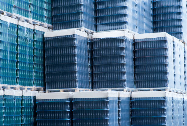 istock Several stacks of colorful beverage bottle crates outdoors 800449132