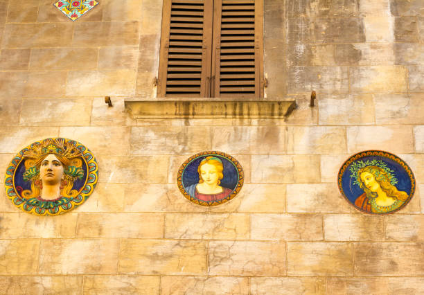 Rome, Italy, November 25 -- The beautiful frescoed facade of the internal courtyard of Palazzo Sciarra, a noble palace near the Trevi Fountain, in the historic heart of the Eternal City. \nBuilt in the late 1800s and painted in Art Nouveau style by the artist Giuseppe Cellini, the courtyard is currently a pedestrian crossing that connects two streets in the Trevi district. Image in High Definition Format.