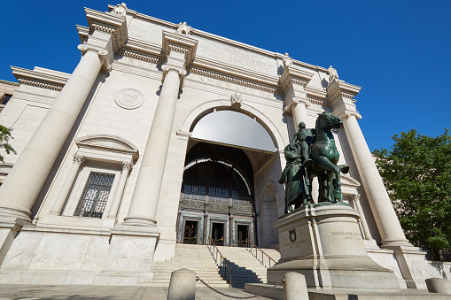 New York - September 13, 2016: American Museum of Natural History building facade in a sunny day, blue sky, nobody. This is one of the largest museum of natural history of the world.