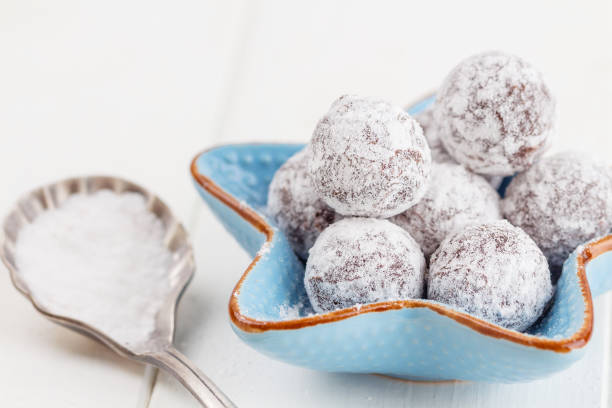 istock Chocolate truffle with sugar powder on white 800468620