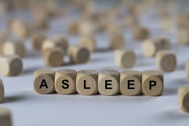 istock asleep - cube with letters, sign with wooden cubes 800468758