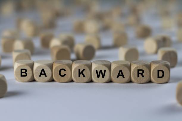 istock backward - cube with letters, sign with wooden cubes 800469200